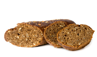 Cut a loaf of black bread with seeds on a white, isolated.