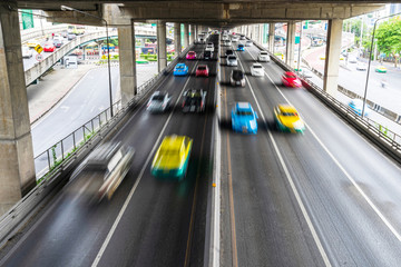 Motion blur of car on the road in the city