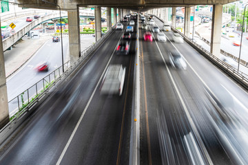 Motion blur of car on the road in the city