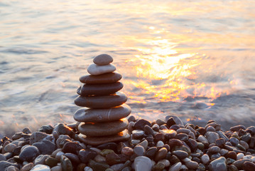 Fototapeta na wymiar Stack of a stones on the beach