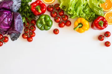 Fotobehang Groenten Fresh colorful organic vegetables on a white background, farming and healthy food concept. Copy space. Flat lay  © ronedya