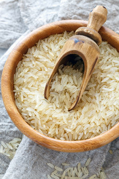 Steamed yellow rice in a wooden bowl.