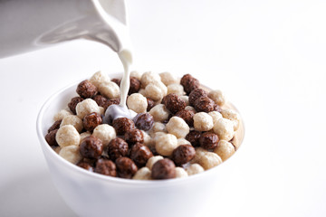 Chocolate cereal balls and milk