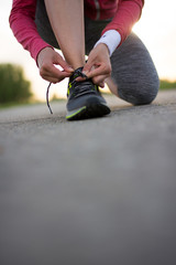 Runner trying running shoes getting ready for jogging