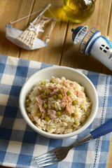 rice with peas and tuna in the white bowl