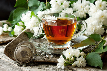 Still life with tea cup on wooden background