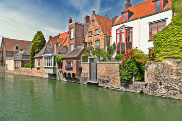 Fototapeta na wymiar Ancient houses on the bank of the channel in Bruges, Belgium.