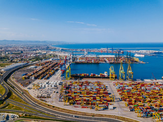Aerial view of the commercial port of Valencia. Container terminal and ship during loading.