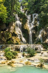 Fototapeta na wymiar Tad Kwang Si (Xi) the biggest water fall land mark in Luang Prabang, Laos ,beautiful turquoise color water at tropical forest in north Lao, for use as a background or travel advertisement image