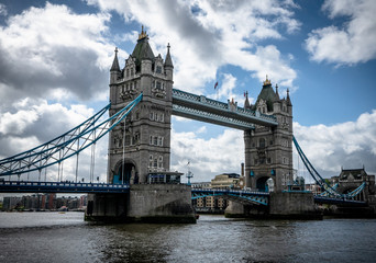 Tower Bridge in London with dramatic cloudy & blue sky