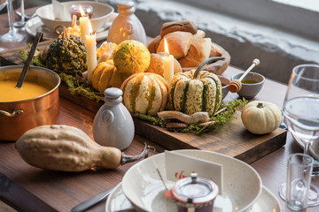 Autumn table setting with pumpkins. Thanksgiving dinner and fall decoration.