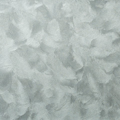 Textured background. Decorative plaster walls, external decoration of facade. Texture of silver