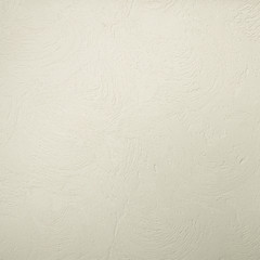 Textured background. Decorative plaster walls, external decoration of facade. Texture of beige.