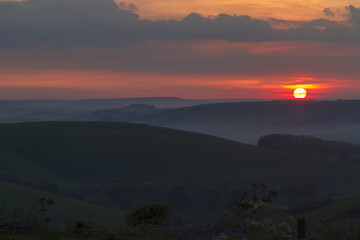 Sunset over rolling hills