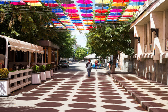 Street decorated with colored umbrellas and cafe in the city of Kropivnitsky, Ukraine