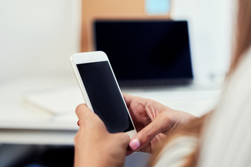 Phone mockup. Closeup of woman using smartphone at office