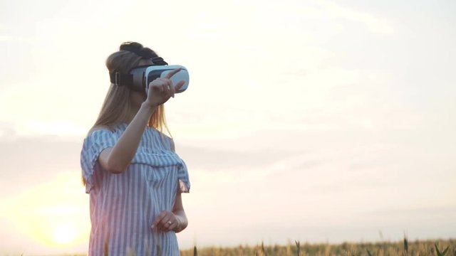 Girl Cheering in Virtual Reality Glasses Outdoors