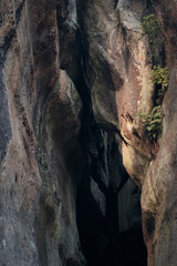 big canyon between mossy rocks;