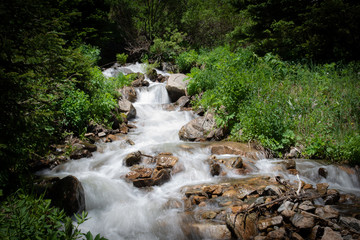 Time lapse waterfall rushing down the mountainside in the Rocky Mountains of Colorado