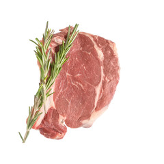 Pork cutlet on a bone with rosemary isolated. Close up