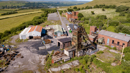 Aerial drone view of a closed, abandoned coal mine (Tower Colliery, South Wales)