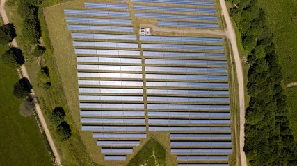 Aerial drone view of solar panels at a solar energy generation farm