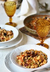 paella from orzo pasta with mussels, seashells and chicken.