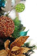 Season Greeting sparkle Christmas ball ornament for festive decorations on a white background. Selective Focus.