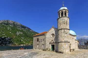 Fototapeta na wymiar Church Our Lady of the Rocks on the Island of Virgin on reef (Gospa od Skrpela Island), Montenegro.