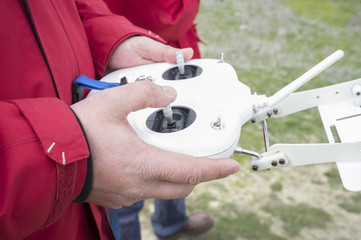 Right control stick for throttle. Pilot maneuver dron on remote controller