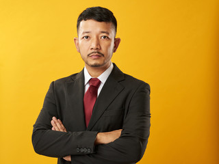 Asian businessman with crossed arms