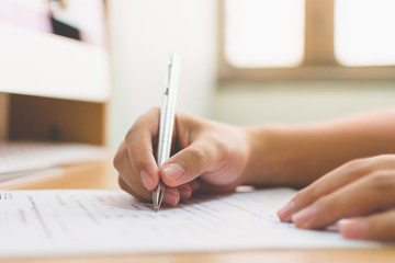 Businessman hand signing the document business contract agreement