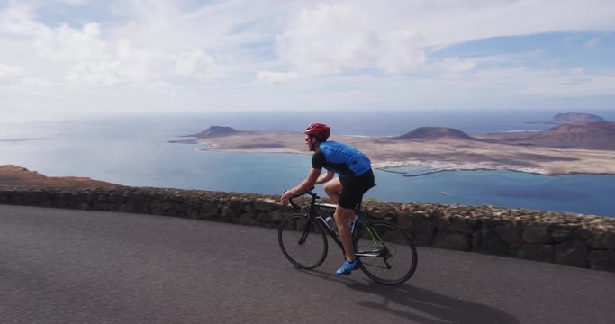 Man cyclist biking on road race cycling on racing bike. Professional cyclist athlete cycling riding bicycle on Lanzarote, Canary Islands, Spain, Europe.