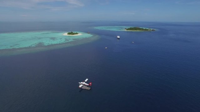 Aerial view of tropical landscape - seaplane parking at sea