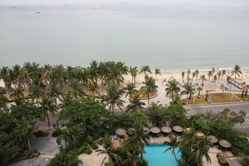 view from a hotel of a swimming pool and beach