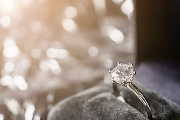 luxury engagement Diamond ring in jewelry gift box with bokeh light background