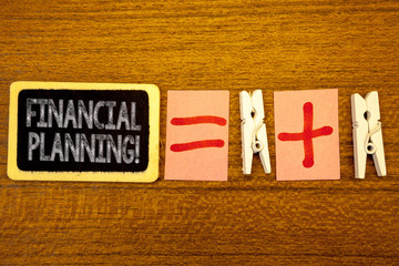 Handwriting text Financial Planning Motivational Call. Concept meaning Accounting Planning Strategy Analyze White paper clip laid woody desk black slate some texts equal and plus mark.