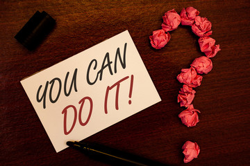 Text sign showing You Can Do It Motivational Call. Conceptual photo Inspirational Message Motivational Positive Text white paper note black marker open cap pink crumbled paper question.