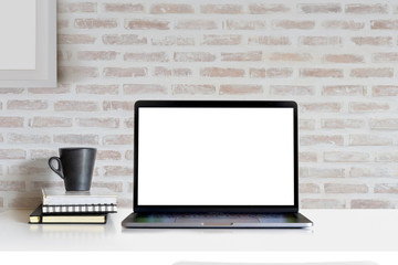 Mock Up workspace, Blank screen laptop and mockup poster at studio workplace.