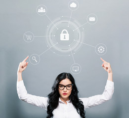 Cyber security with business woman pointing upwards on a gray background