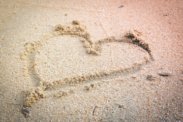 Top view of Heart on sand of the beach.