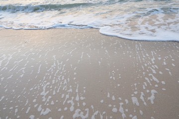 Soft wave of the sea on the sandy beach. Sea with little wave at Cha am, Thailand. Abstract background. Space for text in template.