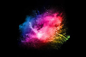 Multicolor powder explosion on black background. 