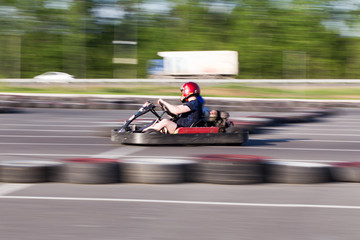Young men driving karts