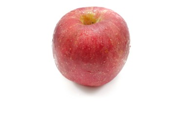 Top view of drops with  red apple  isolated on white background.