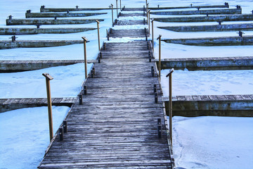 Fototapeta premium Frozen lake viewed from a boat in Kingston, Canada