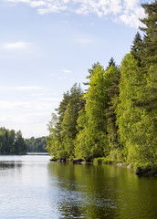 Obraz premium Beautiful river landscape in Finland during summer evening.