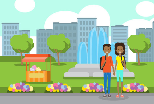 african teenager boy girl couple in love, portrait avatar over city park ice cream fountain flowers green lawn trees template background flat vector illustration