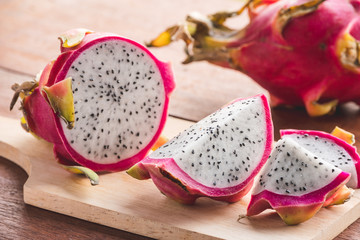 Fresh dragon fruit on wooden table