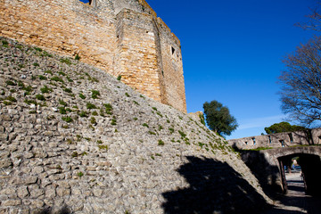 A fragment of an ancient fortress wall with blue sky in the background
